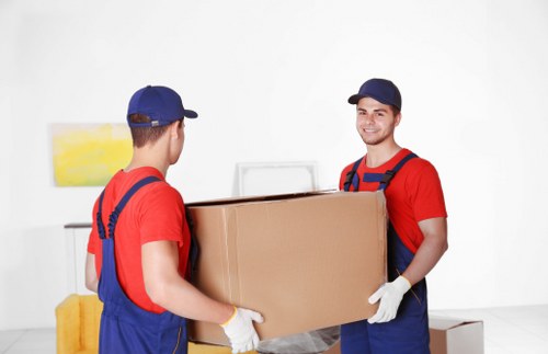 Customer moving storage items safely in a secure self storage facility