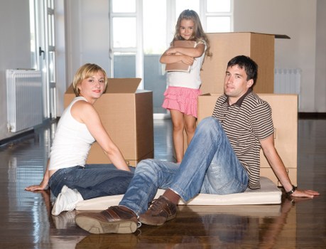 Professional packing service handling fragile items in a central London property