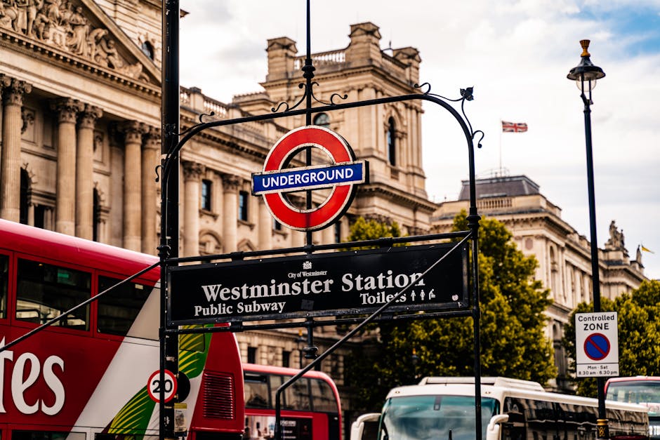 Close-up view of the exterior of a building on Bell Yard in Westminster, showing a rectangular white sign with black and red lettering indicating 'BELL YARD WC2' and 'CITY OF WESTMINSTER.' Below, ther